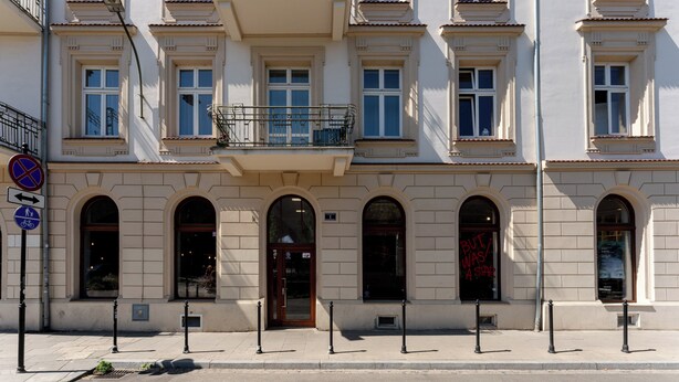 A multi-story building with arched windows and a central entrance. - Morsztynowska Studio with Mezzanine (Kraków)