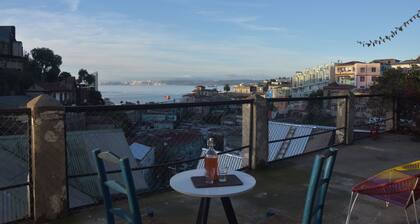 House with large terrace, patio and excellent ocean view, steps from downtown.