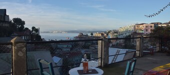 House with large terrace, patio and excellent ocean view, steps from downtown.