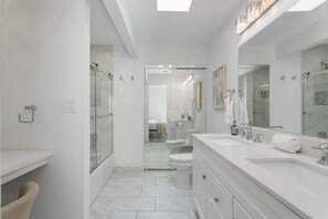 Shower, hair dryer, towels, shampoo