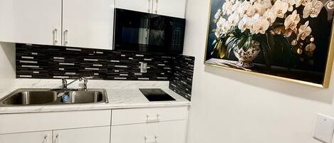 Fridge, microwave, coffee/tea maker, toaster