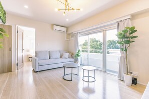 Triple Room, Balcony, Park View | Living area