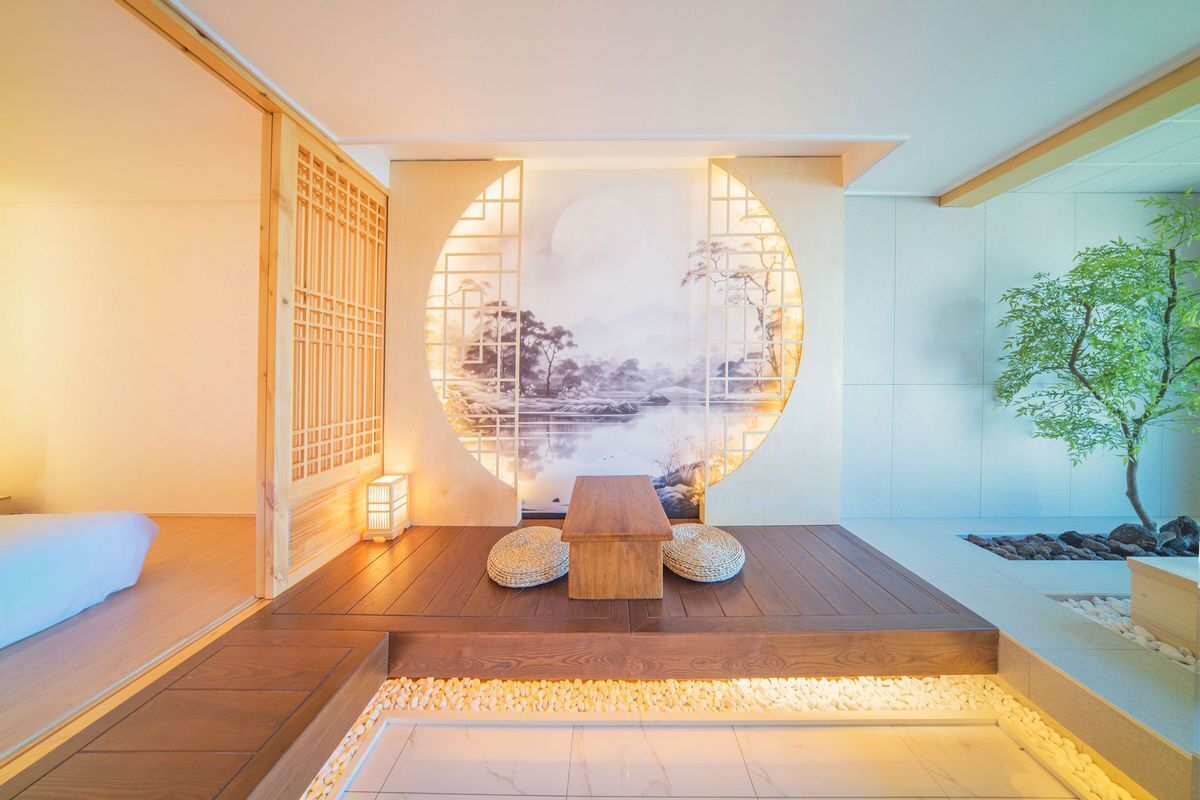 A traditional Japanese room with tatami flooring, a low wooden table, and a shoji screen.