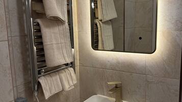 Shower, towels, soap, toilet paper