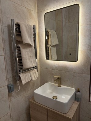 Shower, towels, soap, toilet paper