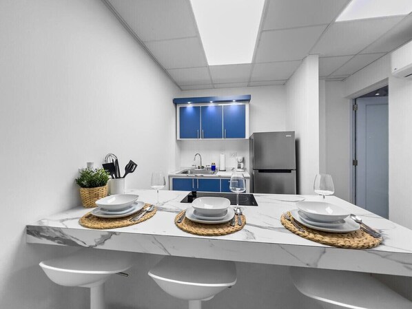 Fridge, microwave, stovetop, coffee/tea maker