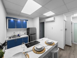 Fridge, microwave, stovetop, coffee/tea maker
