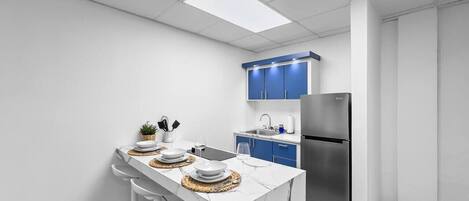 Fridge, microwave, stovetop, coffee/tea maker