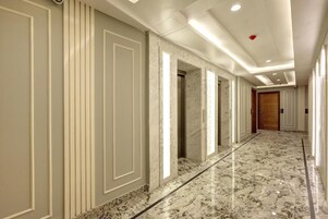 Premium bedding, desk, laptop workspace, iron/ironing board