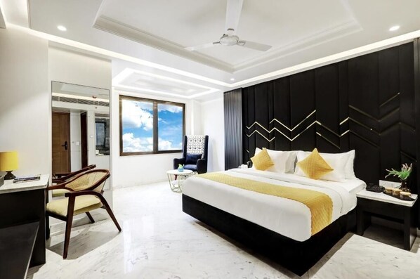 Premium bedding, desk, laptop workspace, iron/ironing board