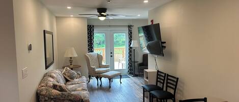 Family Suite | Living area | 20-inch TV with cable channels, DVD player