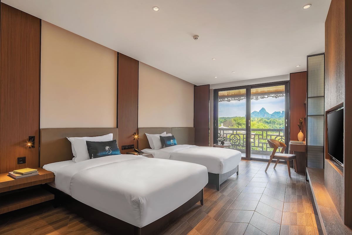 Quarto superior | Edredons de pluma, frigobar (abastecido com itens grátis)