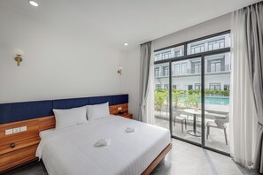 Deluxe Double Room, Balcony, Pool View | In-room safe, blackout drapes, iron/ironing board, free WiFi