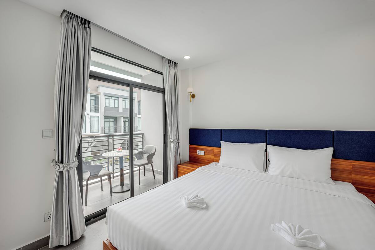 Deluxe Double Room, Balcony, Pool View | In-room safe, blackout drapes, iron/ironing board, free WiFi