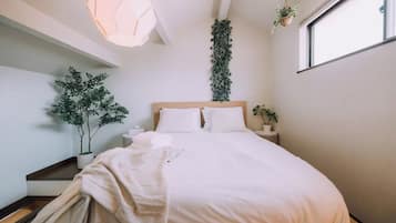 Desk, iron/ironing board, bed sheets