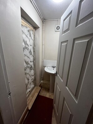 Shower, hair dryer, towels, toilet paper