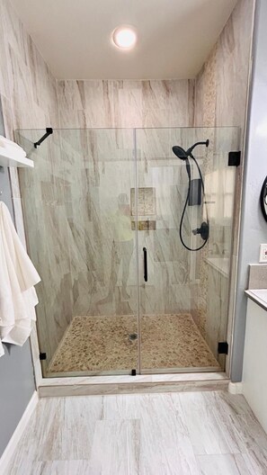 Shower, hair dryer, towels, soap