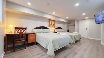 Deluxe Quadruple Room, 2 Double Beds, Private Bathroom | Individually decorated, individually furnished, desk, laptop workspace