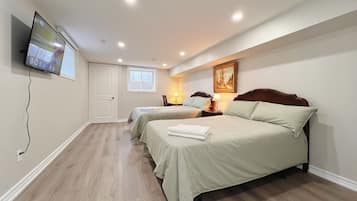 Deluxe Quadruple Room, 2 Double Beds, Private Bathroom | Individually decorated, individually furnished, desk, laptop workspace