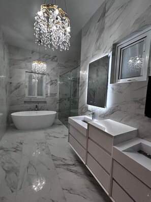 Shower, jetted tub, hair dryer, bidet