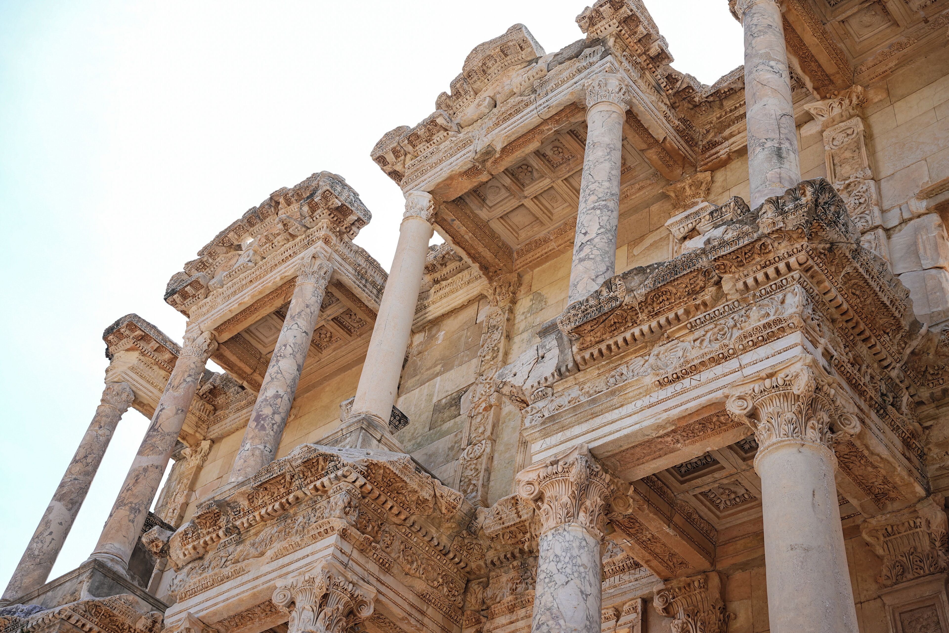 Ancient ruins with columns and intricate carvings.