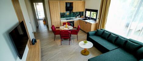 Appartement supérieur, balcon, vue sur la ville | Aire de séjour | Téléviseur connecté, Netflix, services de diffusion en continu