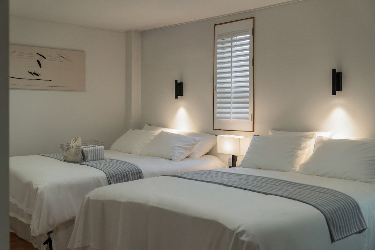 Family Quadruple Room, 2 Queen Beds, City View | Desk, laptop workspace, soundproofing, iron/ironing board