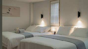 Family Quadruple Room, 2 Queen Beds, City View | Desk, laptop workspace, soundproofing, iron/ironing board