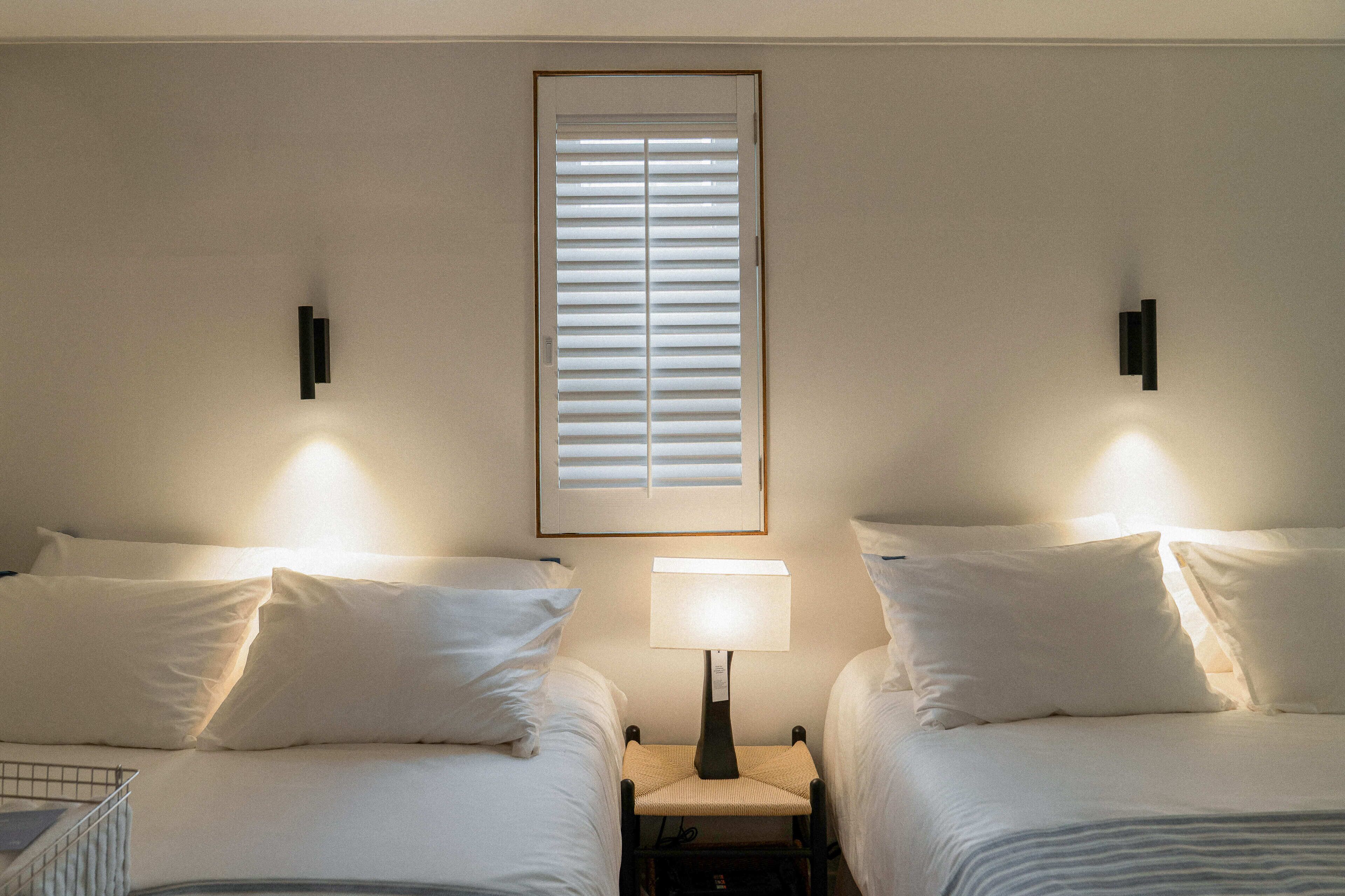 Family Quadruple Room, 2 Queen Beds, City View | Desk, laptop workspace, soundproofing, iron/ironing board