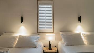 Family Quadruple Room, 2 Queen Beds, City View | Desk, laptop workspace, soundproofing, iron/ironing board