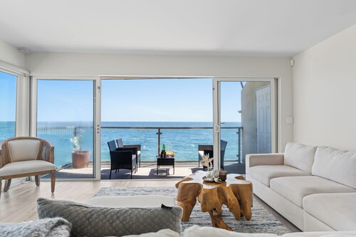 Oceanfront Retreat with Multiple Balconies, Direct Beach Access & Sweeping Views