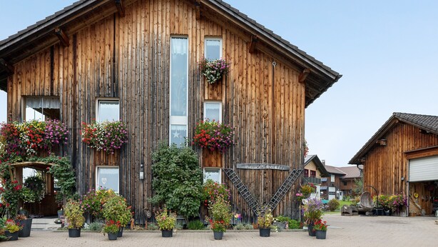 A wooden building with a sign reading 'Hotel Jungfer 239'.