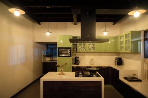 Fridge, microwave, stovetop, coffee/tea maker
