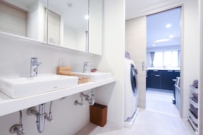 Apartment, Balcony, City View, 1st Floor, Non Smoking | Bathroom | Slippers - URNA SANDS HOTEL (Tokyo)