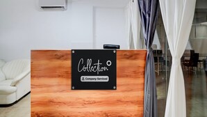 A reception desk with a sign that reads 'Collection' and 'Company-Serviced.' - Classic Laxmi Chowk Hinjewadi (Paud)
