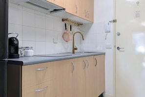 Fridge, microwave, stovetop, coffee/tea maker