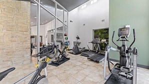 A gym with treadmills, elliptical machines, and a stationary bike. - The Landry 187 | Spacious and Cozy 1 Bedroom 1bth (Arlington)