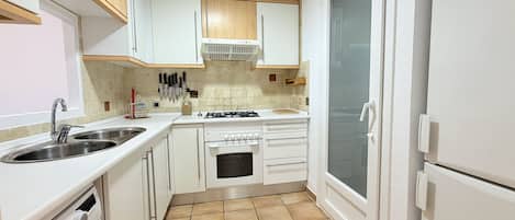 Coffee/tea maker, fridge, microwave, oven