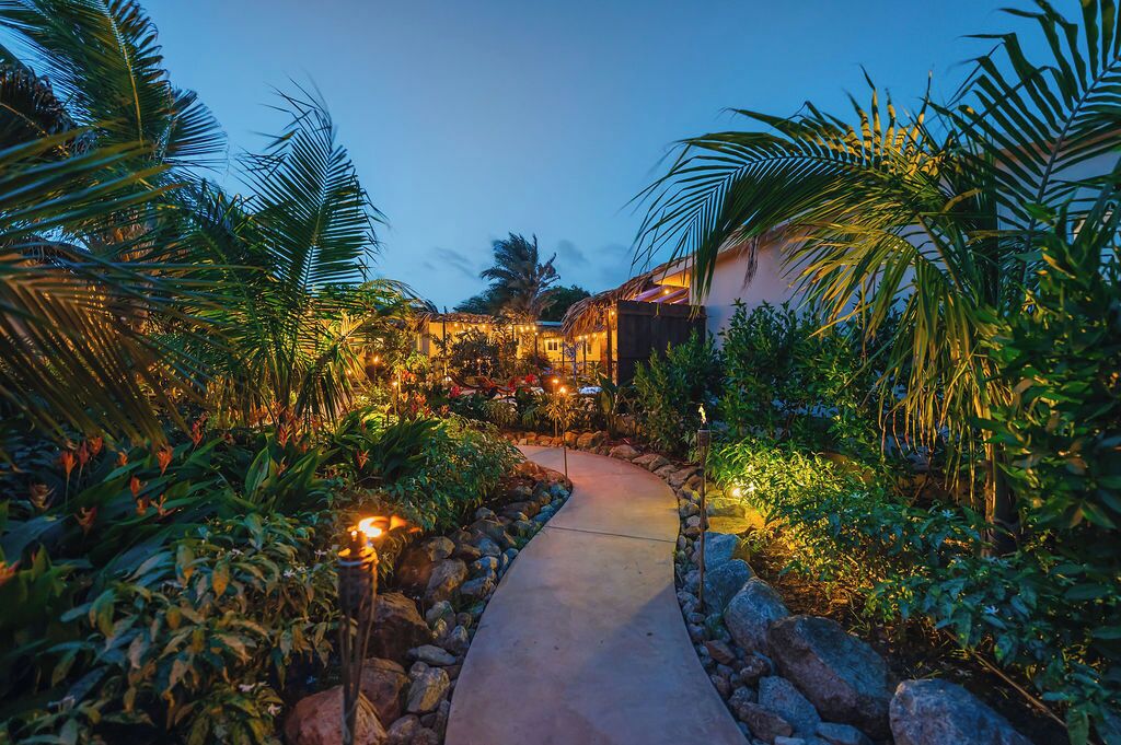 A charming walkway guides you into the heart of Sol Vista Estate’s garden.