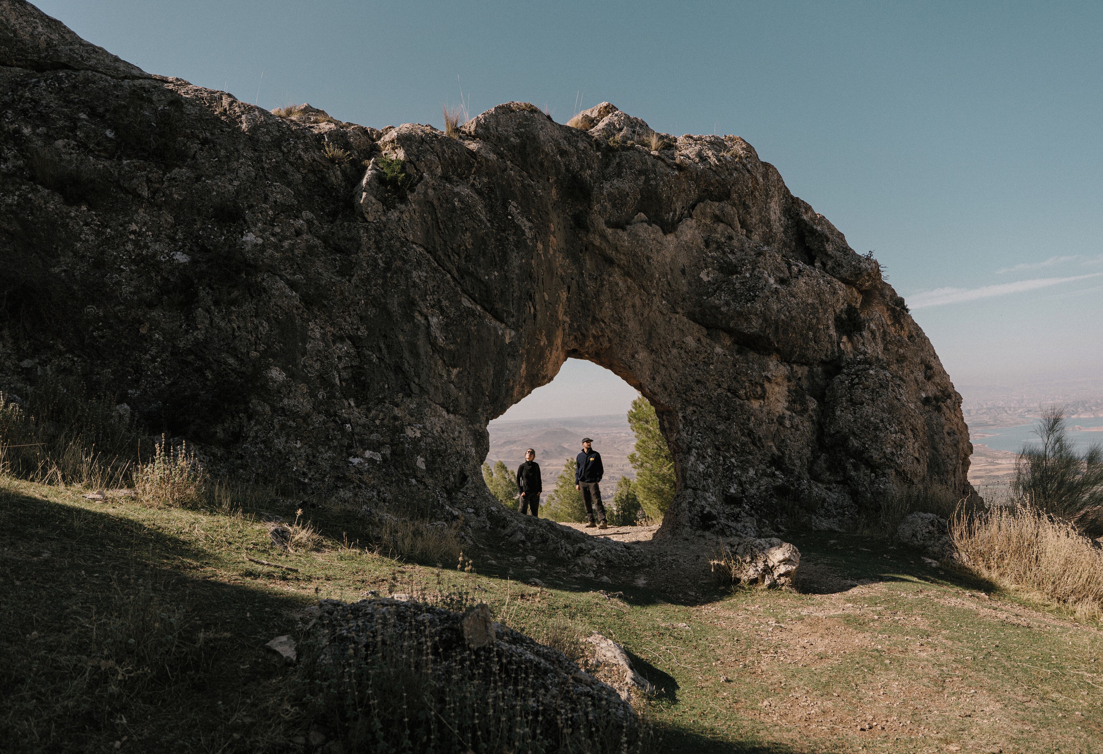 A natural rock formation with a large archway.
