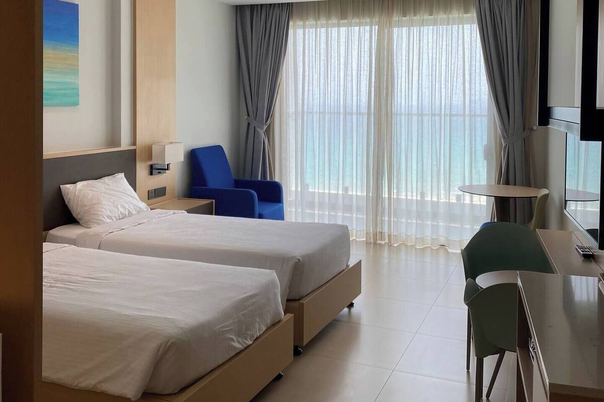 Deluxe Double Room, Balcony, Beach View | In-room safe, blackout drapes, soundproofing, free WiFi