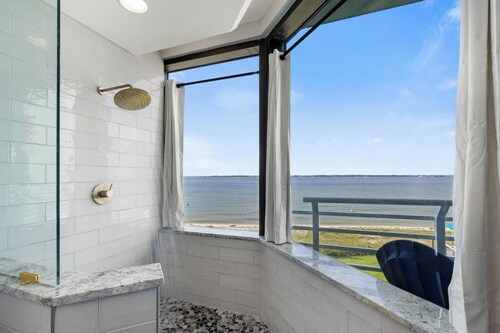Your beachfront getaway awaits in this 3BR/3BA waterfront haven in Pensacola.