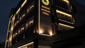 A building with a sign for the Golden Sea Hotel and Annai Marriage Hall. - Hotel Golden Sea (Kanyakumari)