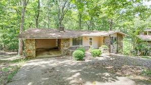 A two-story house with a stone exterior and a covered porch. - 1/2 Mi to Desoto Lake: Hot Springs Village Home (Hot Springs Village)