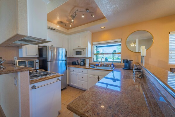 Fridge, microwave, stovetop, coffee/tea maker