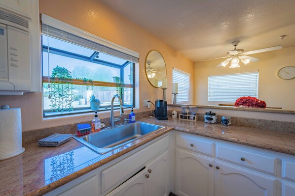 Fridge, microwave, stovetop, coffee/tea maker