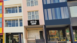 A multi-story hotel with a sign reading 'HOTELO'. - Hotel O Green City Dhakoli Formerly Swagat (Dera Bassi)
