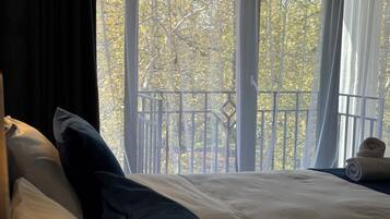 Suite, Balcony, City View | Individually decorated, individually furnished, desk, laptop workspace