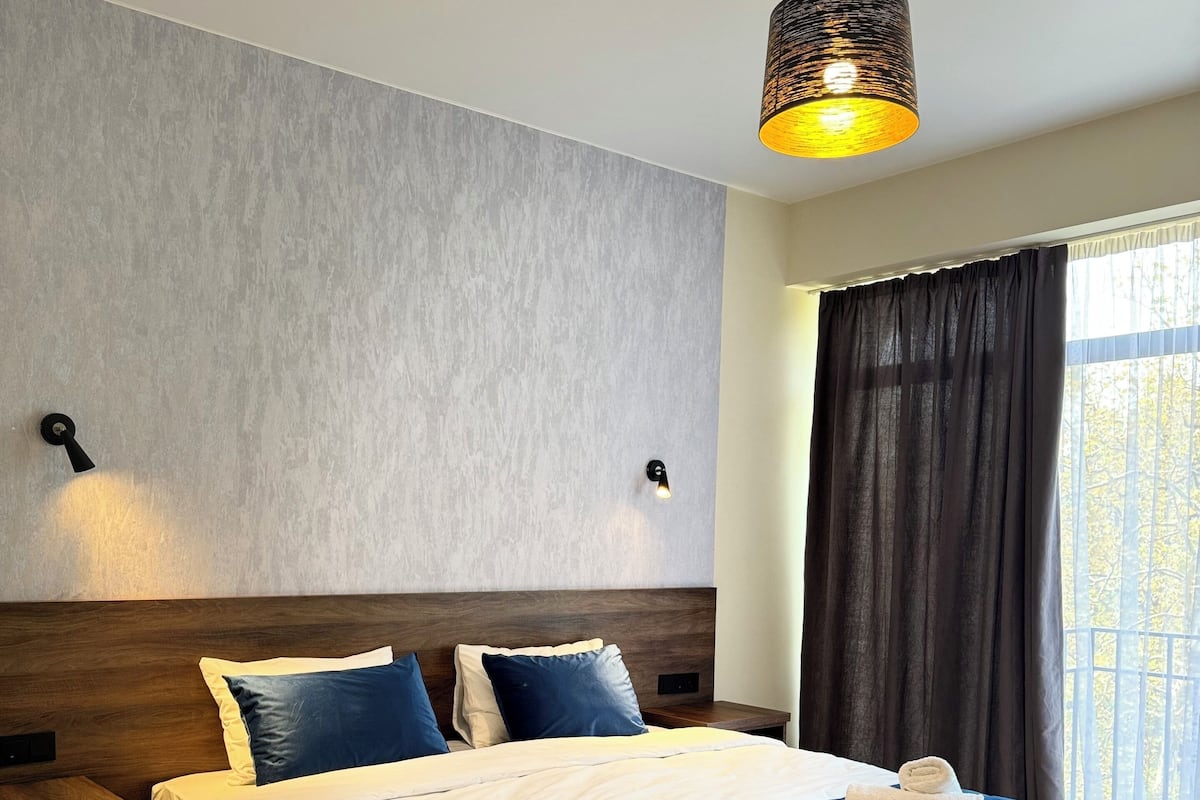 Suíte, sacada, vista para a cidade | Wi-Fi de cortesia, roupa de cama