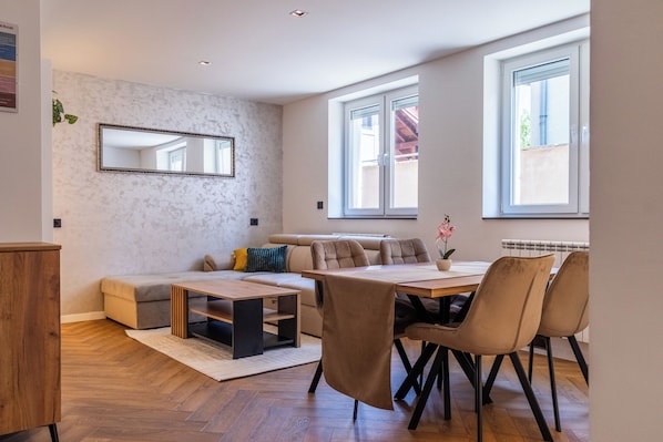 Deluxe Apartment, 1 Bedroom | Living area | 43-inch LED TV with cable channels
